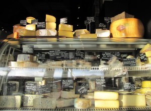 An assortment of cheeses welcomes customers as they enter.
